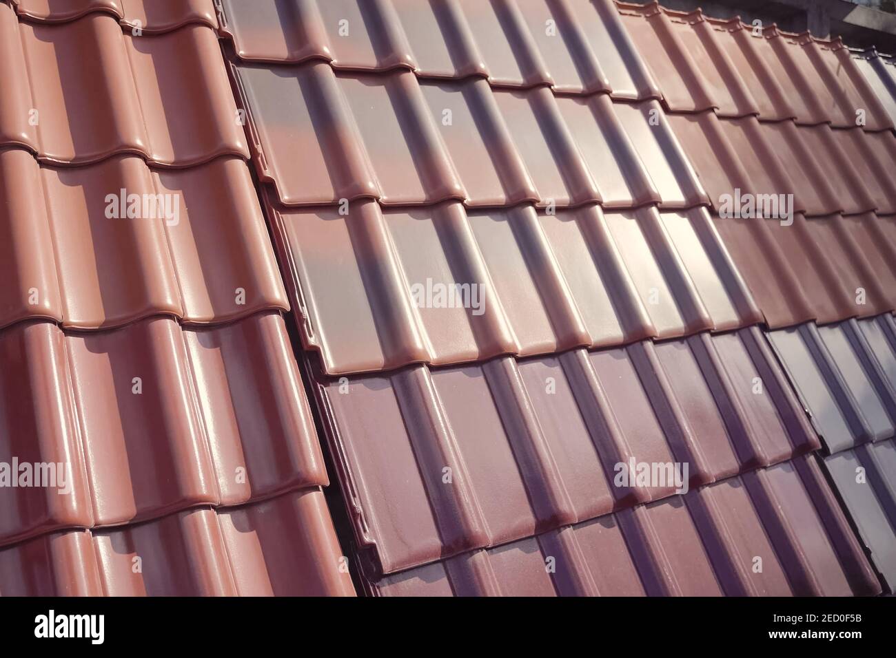 Samples of ceramic roofing tiles in a warehouse of a roofing materials store. Modern roof made