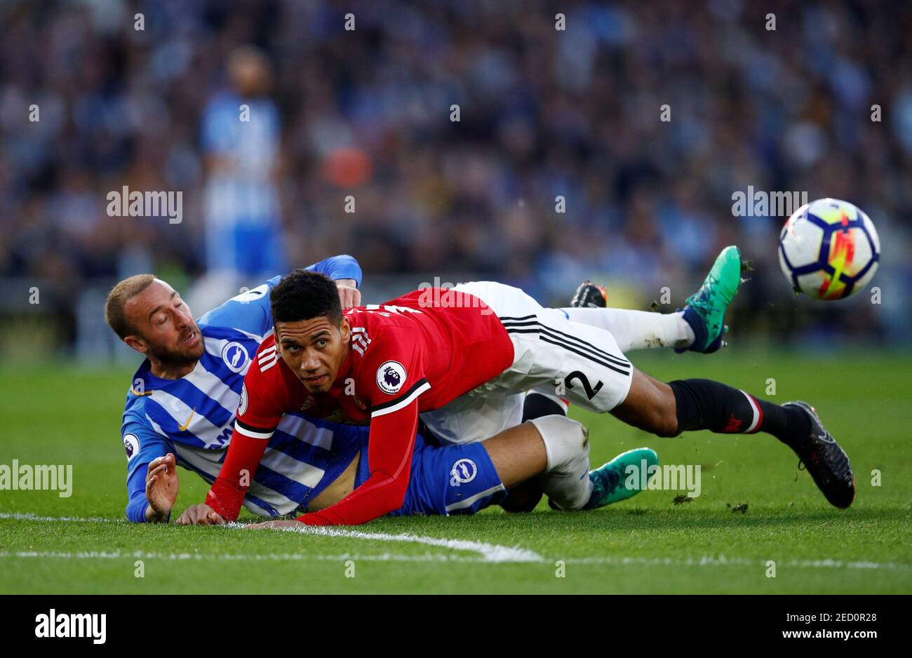 Soccer Football - Premier League - Brighton & Hove Albion v Manchester United - The American Express Community Stadium, Brighton, Britain - May 4, 2018 Manchester United's Chris Smalling in action with Brighton's Glenn Murray REUTERS/Eddie Keogh EDITORIAL USE ONLY. No use with unauthorized audio, video, data, fixture lists, club/league logos or "live" services. Online in-match use limited to 75 images, no video emulation. No use in betting, games or single club/league/player publications. Please contact your account representative for further details. Stock Photo
