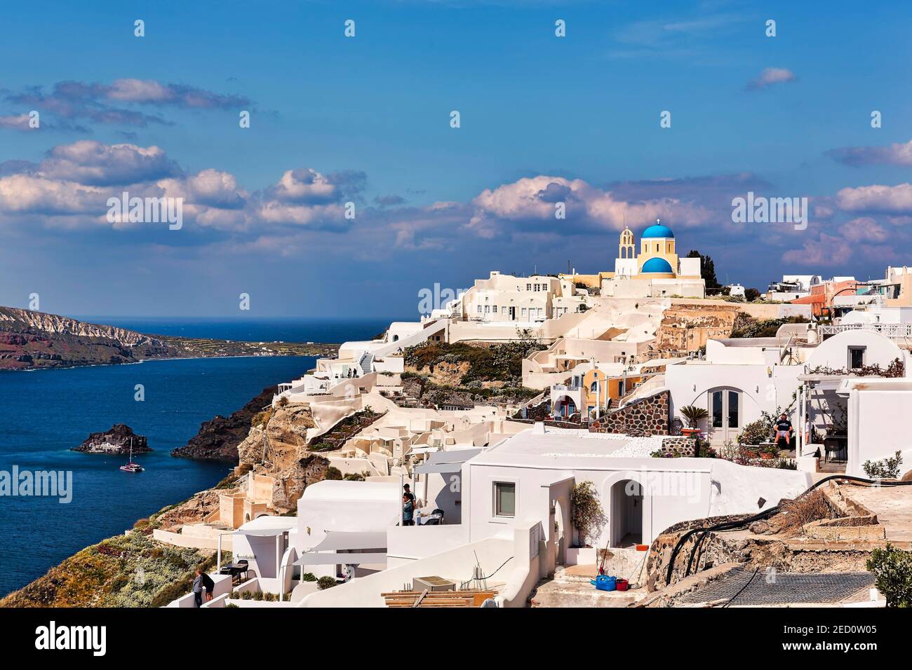 White houses and church Panagia Platsani on a hillside, Oia, Santorini, Greece Stock Photo