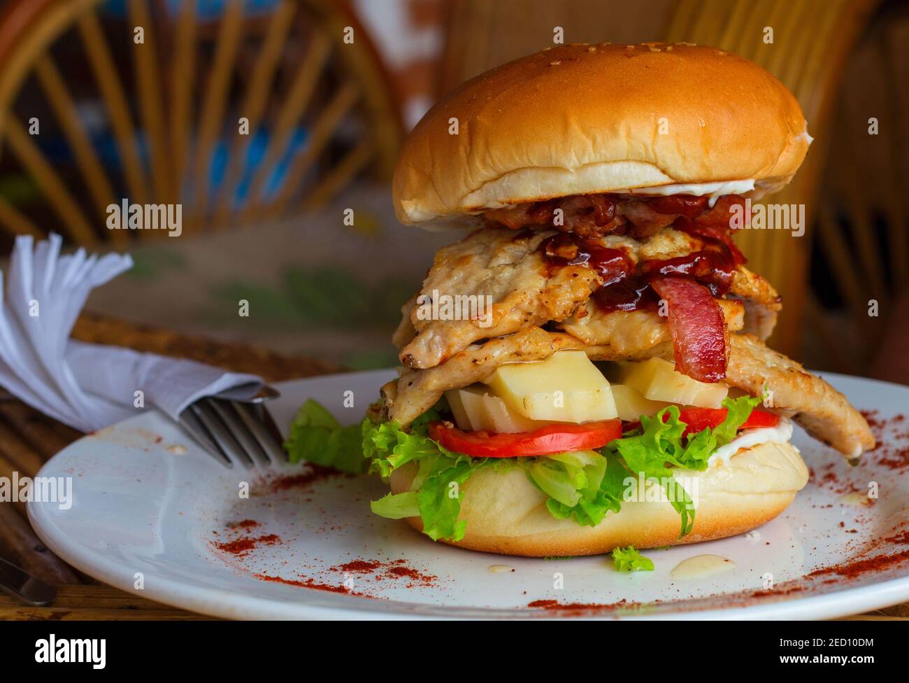 Big burger on the plate. Beef burger with cheese, ham and tomato on white  plate. Rich nutrititive breakfast. American food hamburger. Simple snack  ser Stock Photo - Alamy