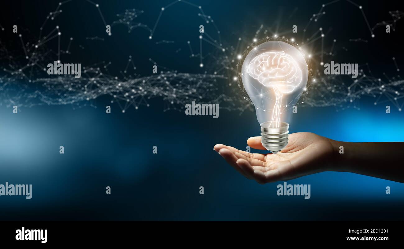 Businessman holding Light bulbs with Brain inside and Low poly wireframe outside. Creative and innovation inspiration. Business Bright idea concept. Stock Photo