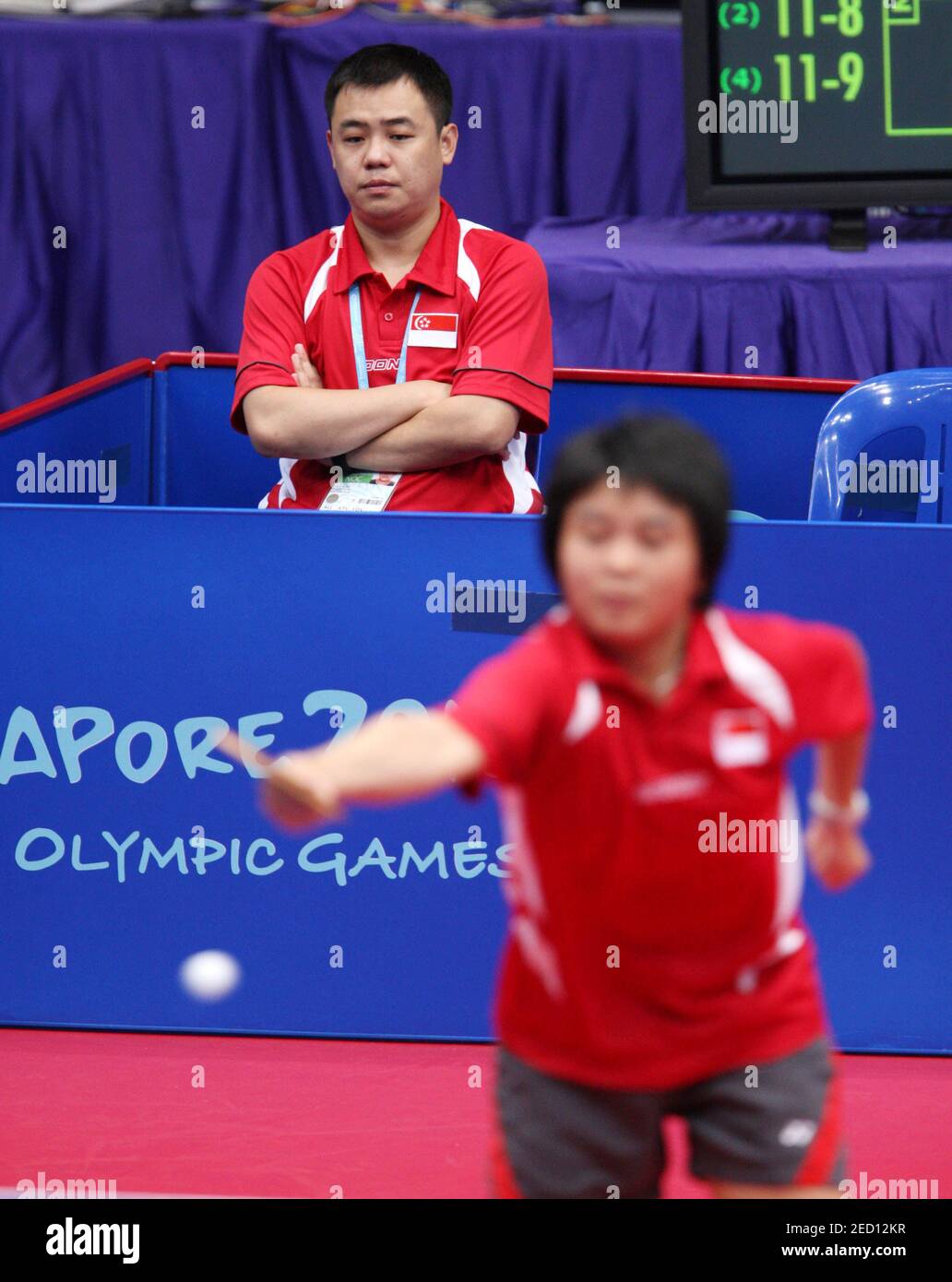 General Sport Singapore 2010 Youth Olympic Games Table Tennis Singapore 24 8 10 Table Tennis Mixed Team First Stage Singapore S Isabelle Li Siyun In Action As Her Coach