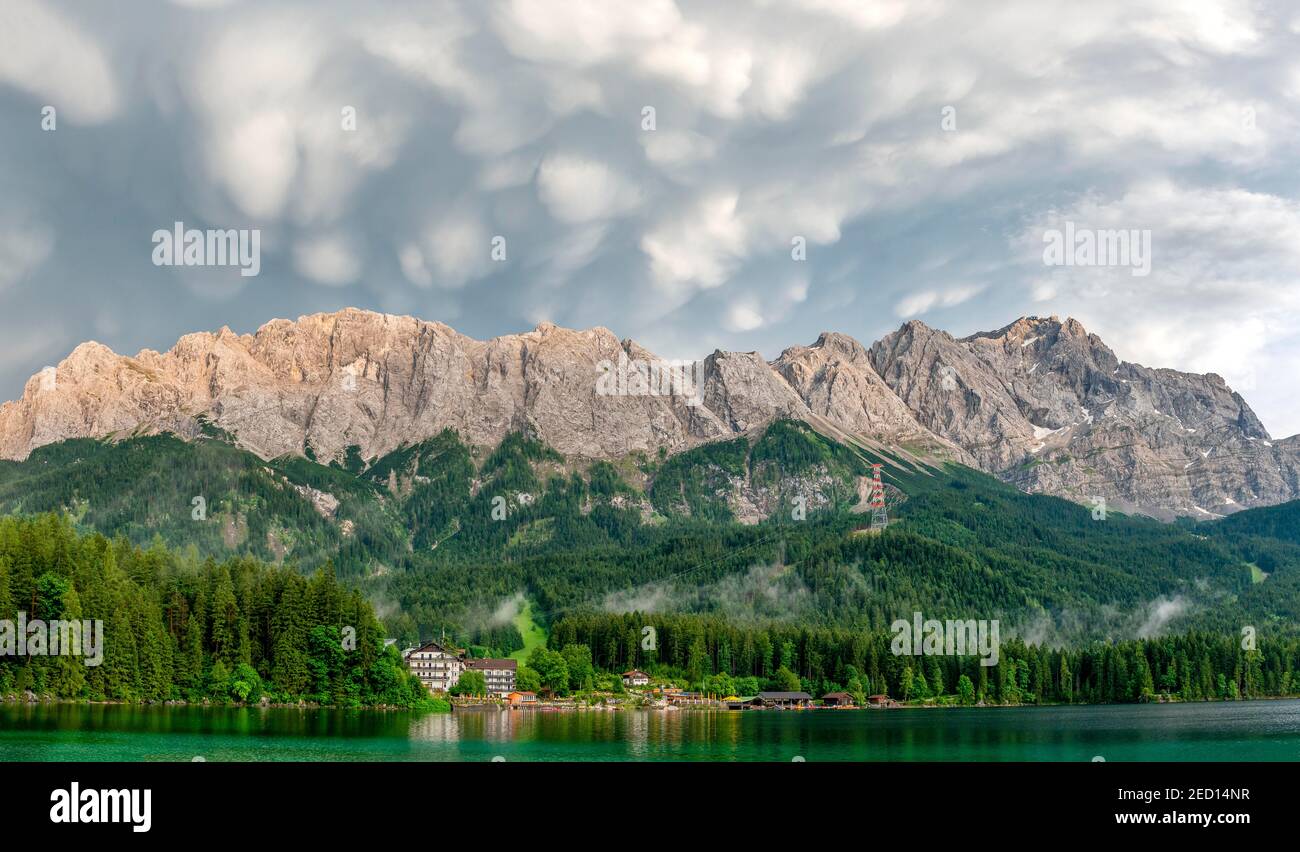 Eibsee lake in front of Zugspitze massif with Zugspitze, dramatic Mammaten clouds, Wetterstein range, near Grainau, Upper Bavaria, Bavaria, Germany Stock Photo
