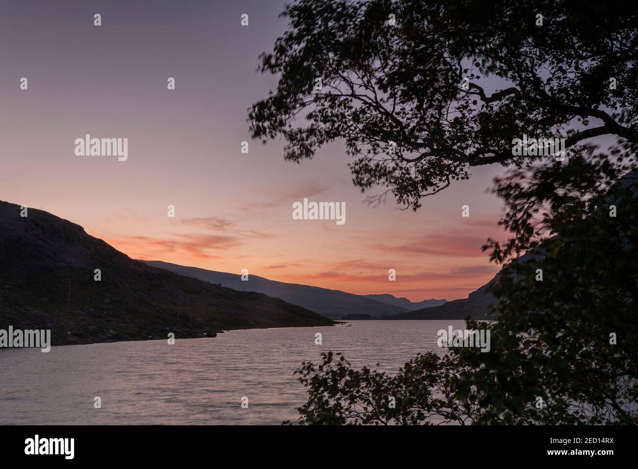 Dawn breaking over Llyn Ogwen, Snowdonia, North Wales Stock Photo