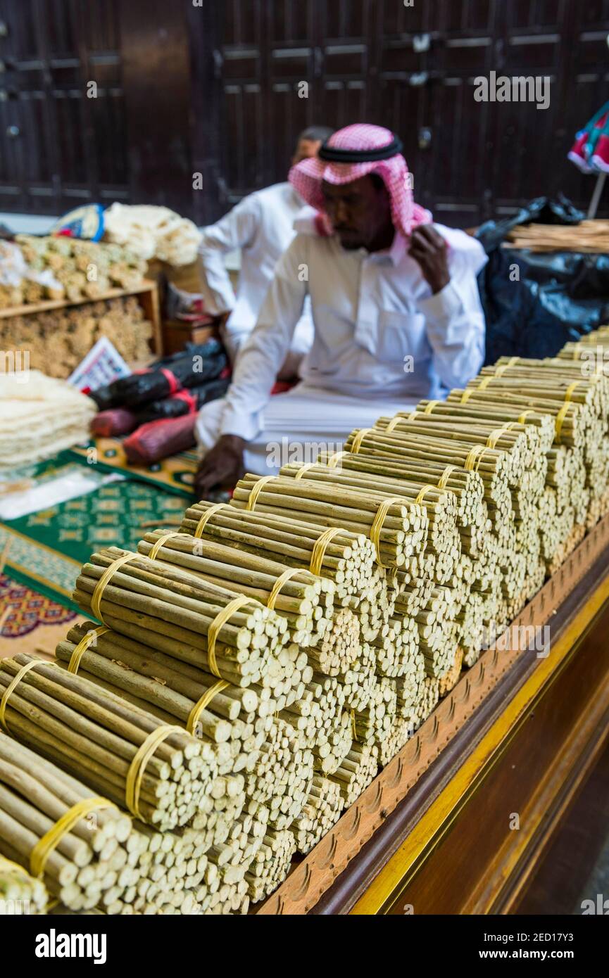 Man selling chewing sticks, old town of Jeddah, Saudi Arabia Stock Photo