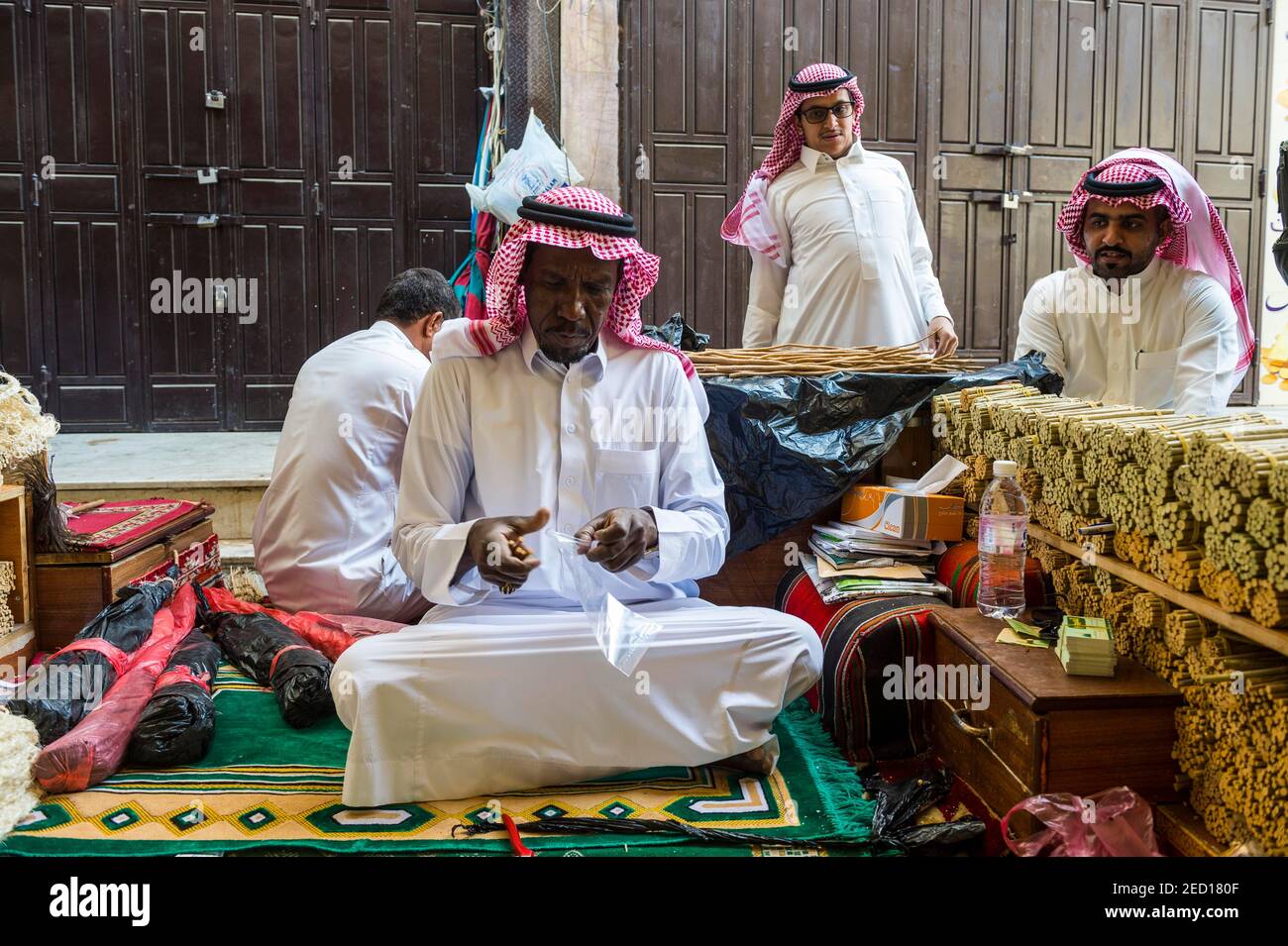 Man selling chewing sticks, old town of Jeddah, Saudi Arabia Stock Photo