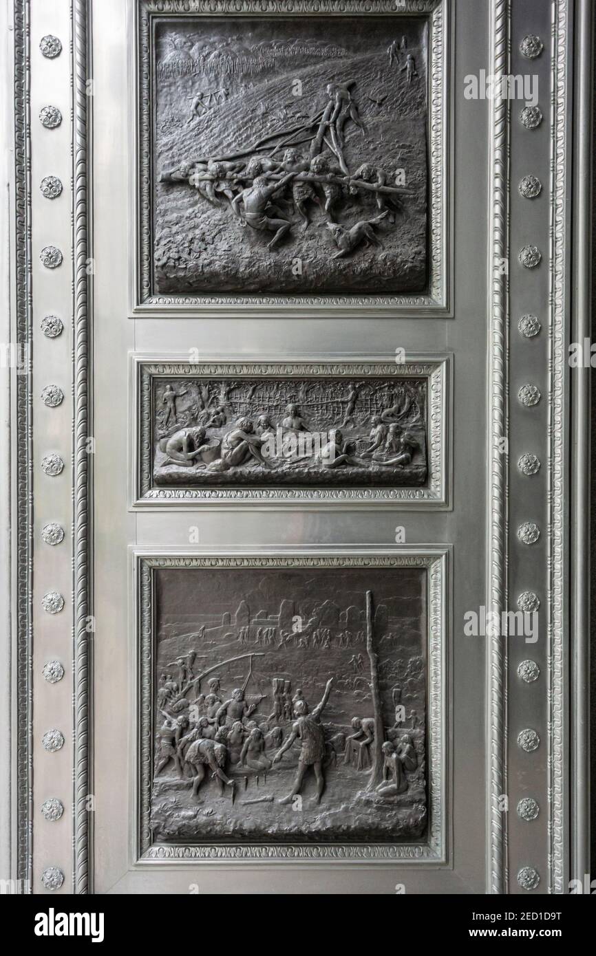 Bas Reliefs on Door, by William Bateman Fagan (1860-1948), in the city of London, UK Stock Photo