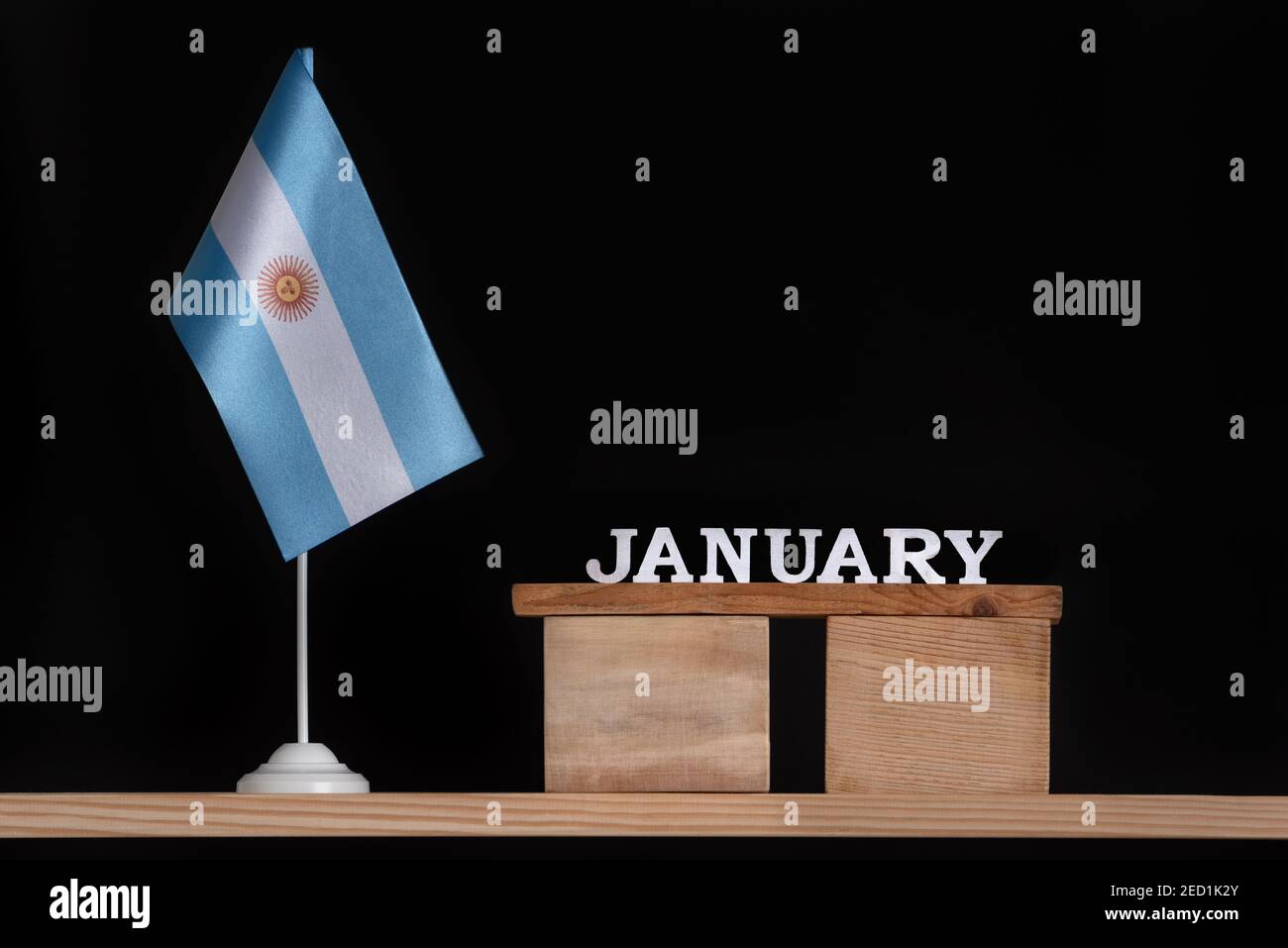 Wooden calendar of January with Argentine flag on black background. Holidays  of Argentina in January Stock Photo - Alamy