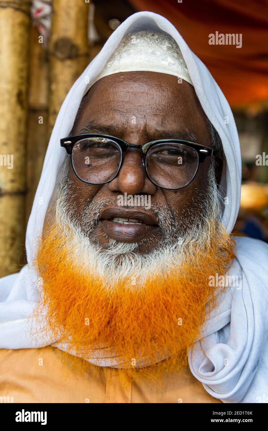 Man with coloured beard, Kawran Bazar, Dhaka, Bangladesh Stock Photo