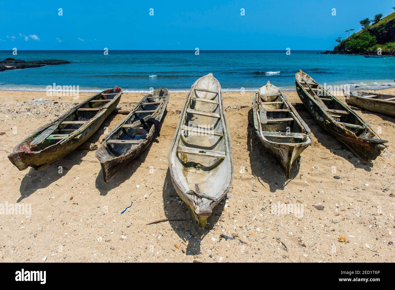 Wooden fishing boats in the fishing village Morro Peixe in northern Sao Tome, Sao Tome and Principe, Atlantic ocean Stock Photo