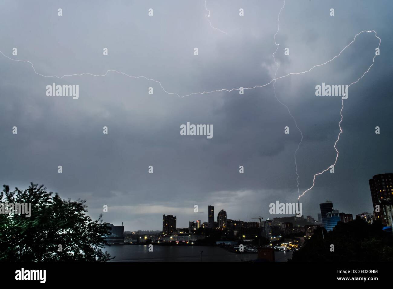 Lightning during a thunderstorm in the sky. Natural phenomenon of