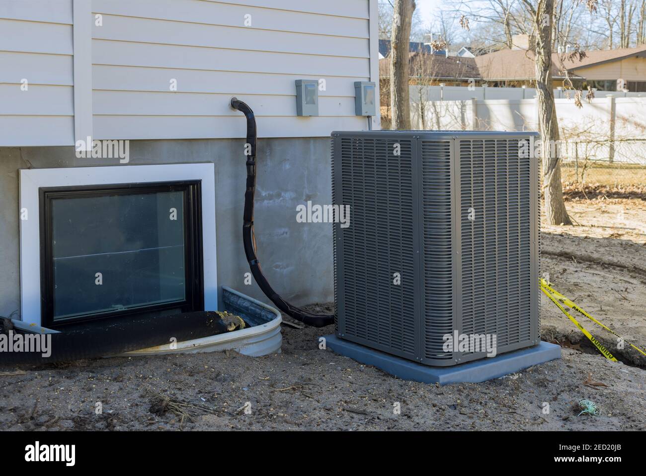 Air conditioning system unit installed outside facade of the new house