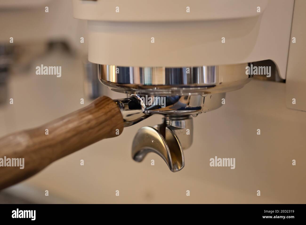 closeup of double spout portafilter holder in professional Synesso espresso machinge group head, no people Stock Photo