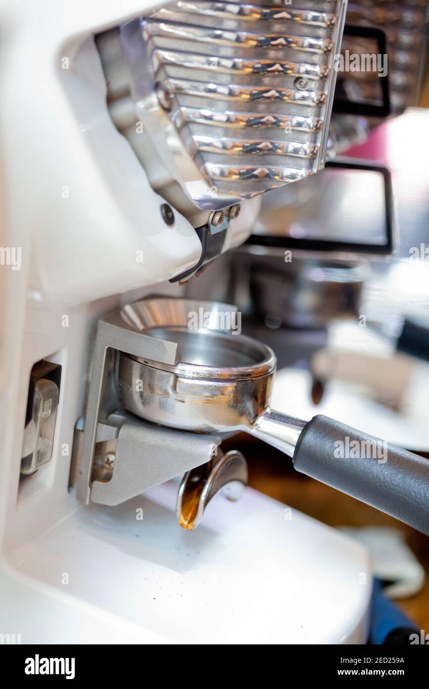 closeup of empty espresso holder in modern grinder, nobody Stock Photo