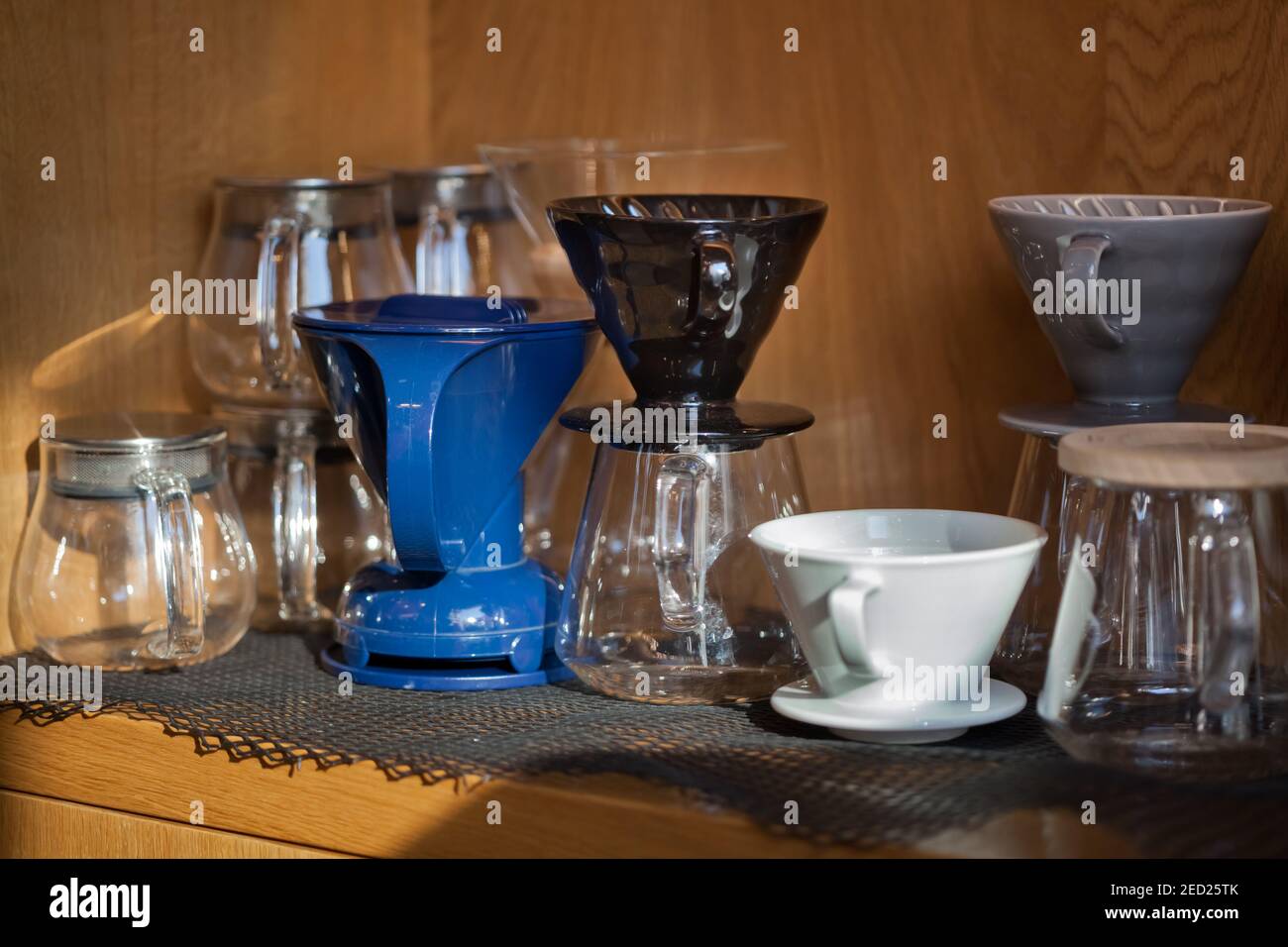 several glass and ceramic pour over devices closeup in coffee shop, nobody Stock Photo