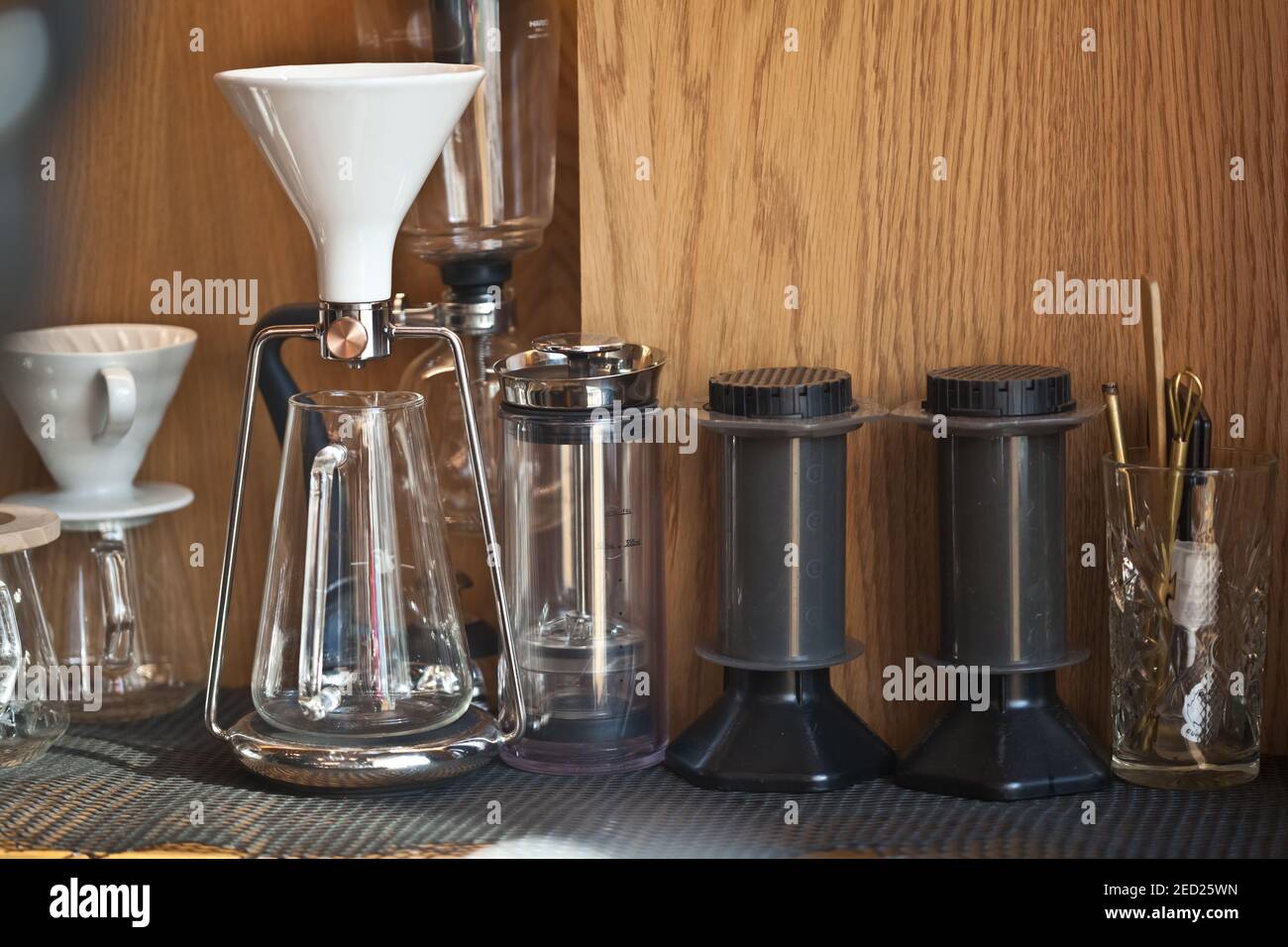 coffee hand brewing devices in coffee shop - gina, american press and aeropress, nobody Stock Photo