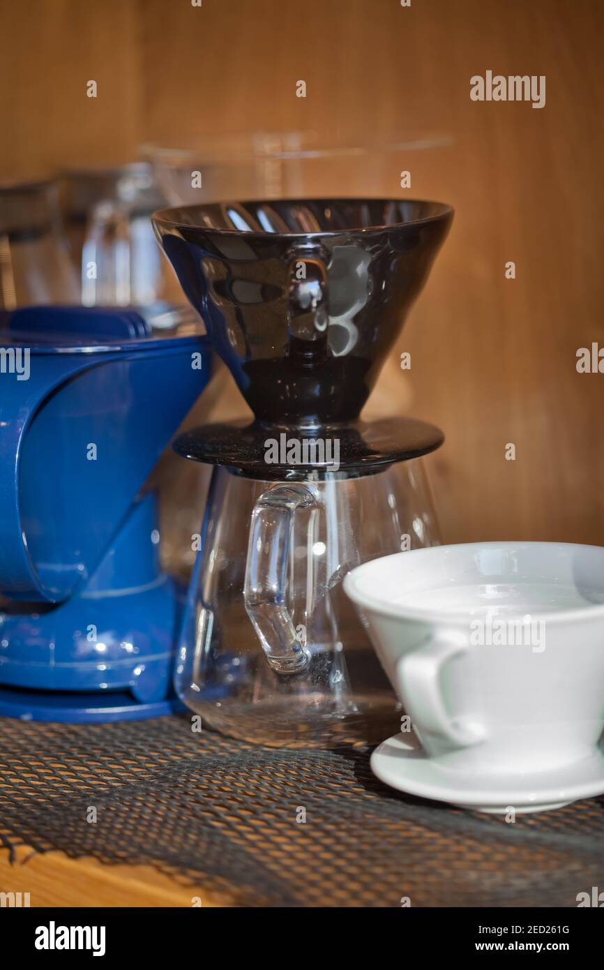several glass and ceramic pour over devices closeup in coffee shop, nobody Stock Photo
