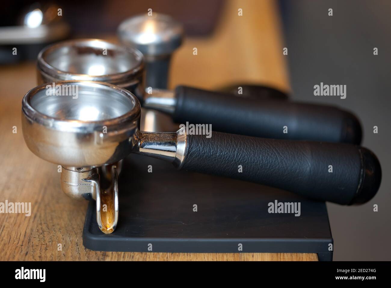espresso machine holders on rubber pad at table in coffee shop, closeup, nobody Stock Photo