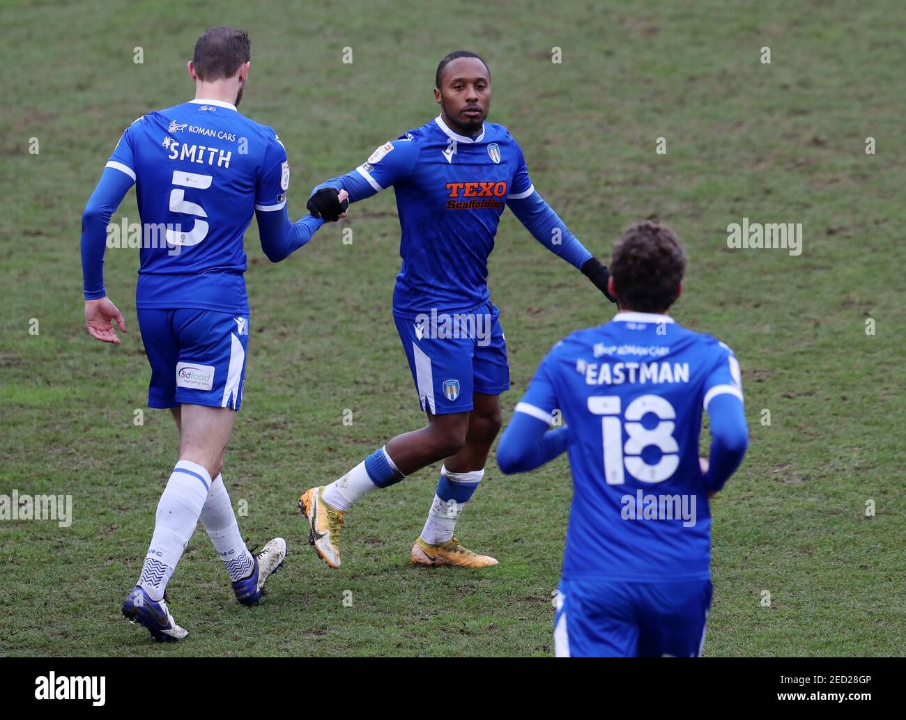 Colchester United's Callum Harriott (right) celebrates scoring their side's first goal of the game during the Sky Bet League Two match at the JobServe Community Stadium, Colchester. Picture date: Sunday February 14, 2021. Stock Photo