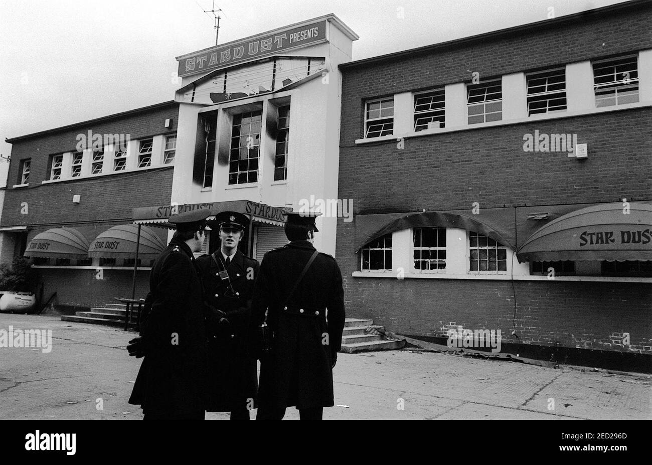 File photo dated 14/2/1981 of police stand outside the main entrance of a fire-blackened Stardust Disco in Artane, Dublin, where in the early hours 48 youngsters perished in a fire. Issue date: Sunday February 14, 2021 Stock Photo