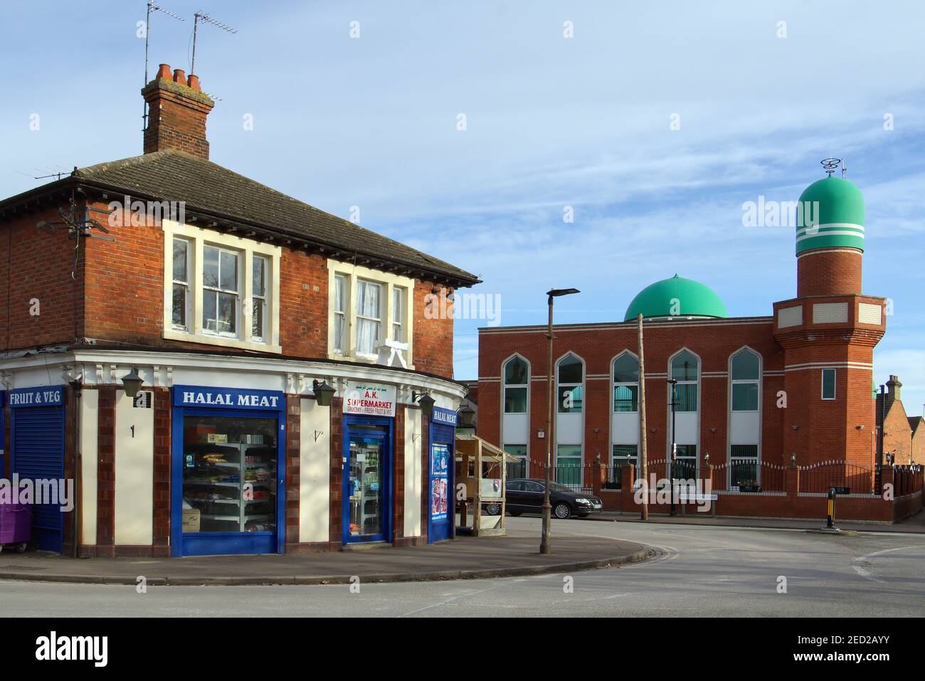 Jameh Masjid Gulshan-e-Bagdhad Mosque and halal butchers shop at Queens Park, Bedford - muslim place of worship at Bedford, Bedfordshire, UK Stock Photo