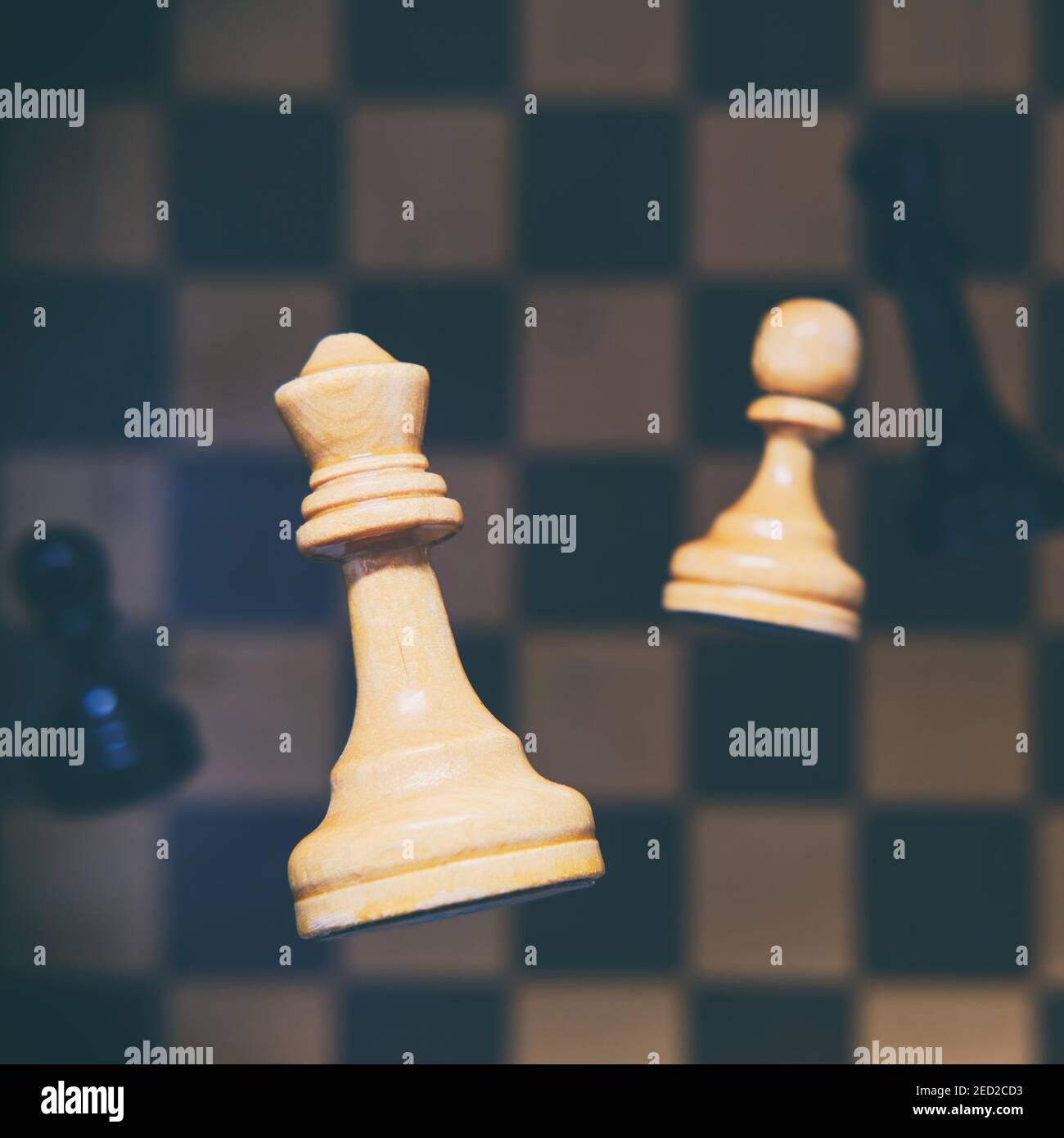 Chess Queen Beats King Between Other Pieces On The Chessboard