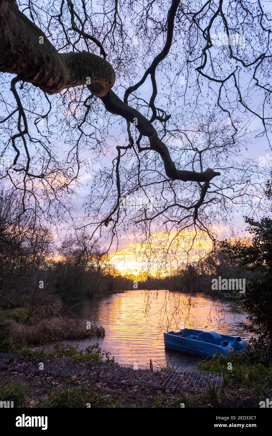 A paddle boat beside Boating Lake at sunset, Battersea Park, London, 3