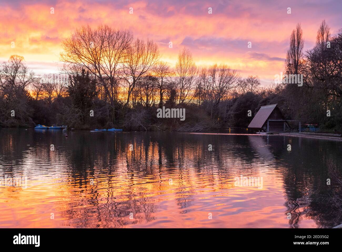 Sunset and reflections over Boating Lakes, Battersea Park, London, 3 February 2021 Stock Photo