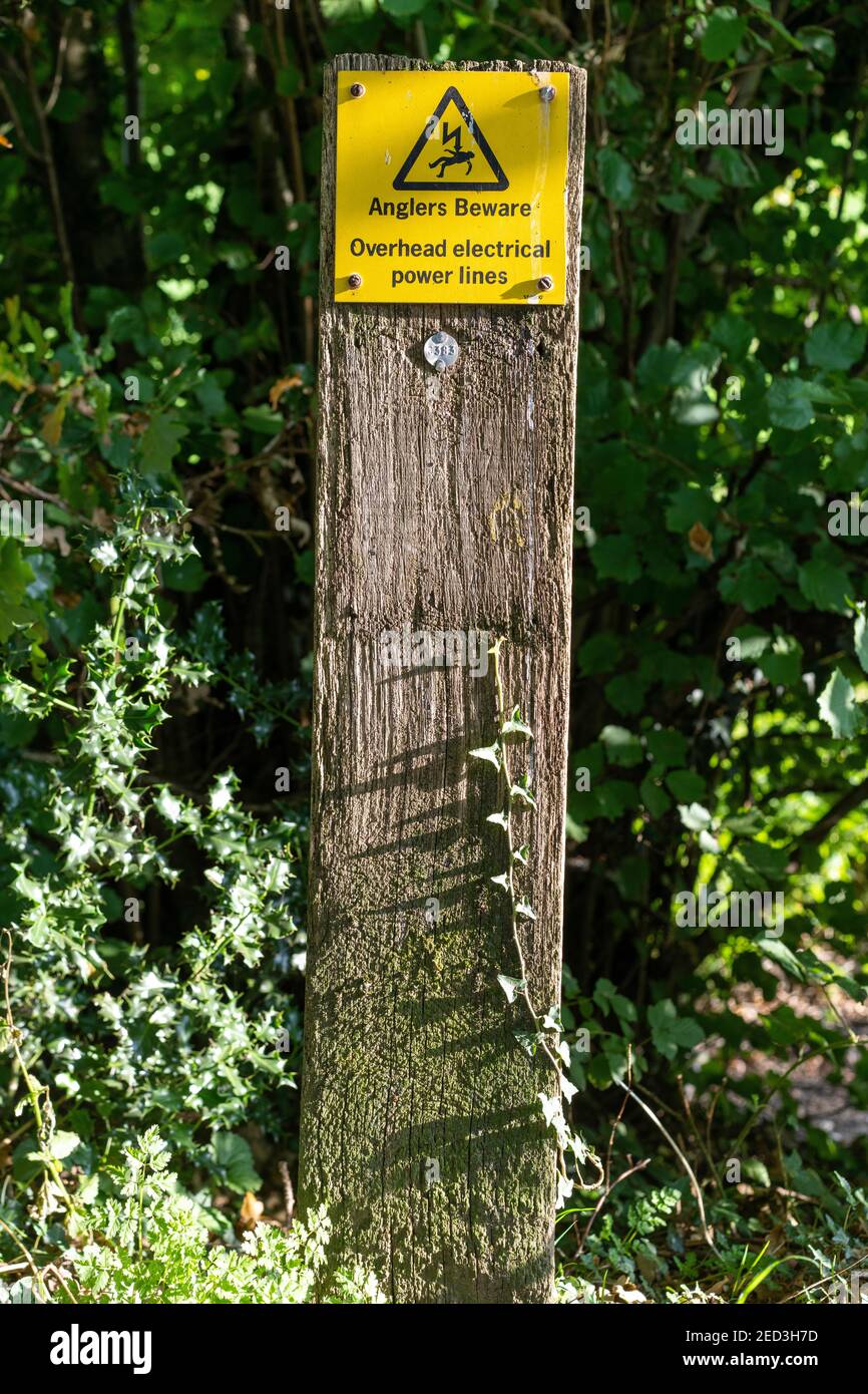 Canalside signage, beware electricity overhead power lines, Monmouthshire and Brecon Canal Stock Photo