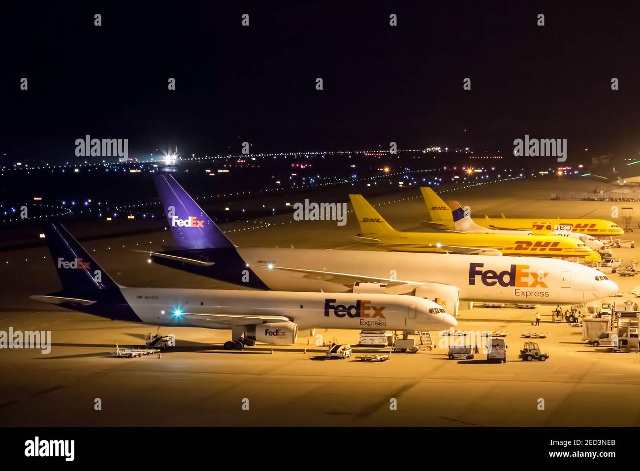 Night View of FedEx and DHL Cargo Aircraft at Cologne Bonn Airport March 2019 Stock Photo