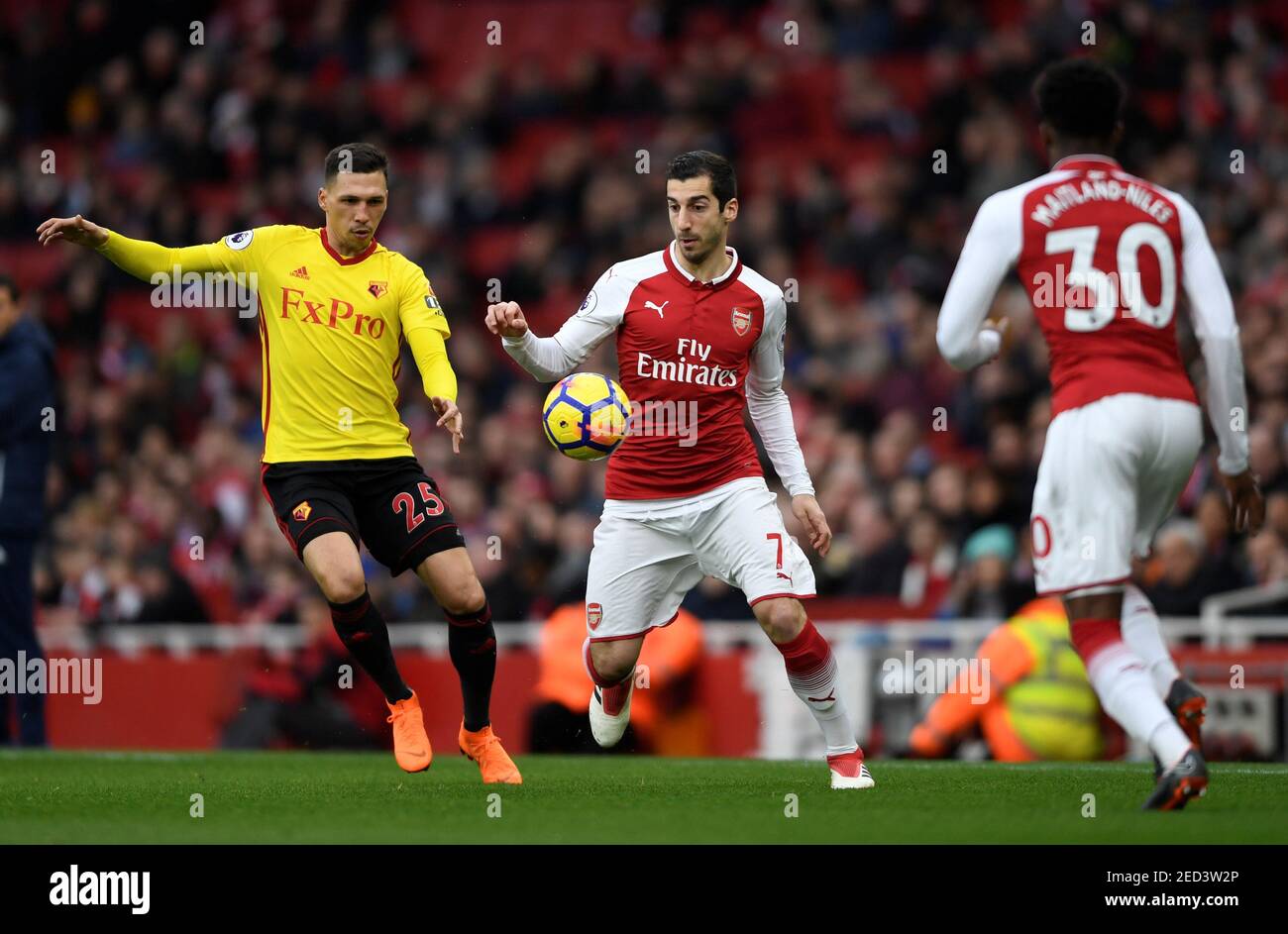 Soccer Football - Premier League - Arsenal vs Watford - Emirates Stadium, London, Britain - March 11, 2018   Arsenal's Henrikh Mkhitaryan in action with Watford's Jose Holebas     Action Images via Reuters/Tony O'Brien    EDITORIAL USE ONLY. No use with unauthorized audio, video, data, fixture lists, club/league logos or 'live' services. Online in-match use limited to 75 images, no video emulation. No use in betting, games or single club/league/player publications.  Please contact your account representative for further details. Stock Photo