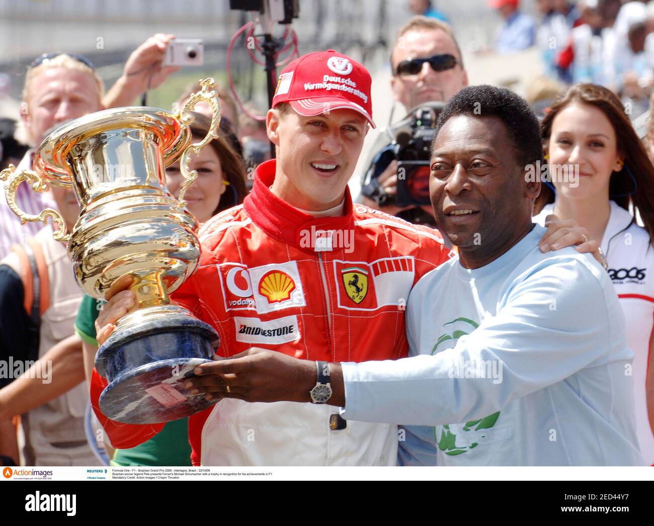 Formula One - F1 - Brazilian Grand Prix 2006 - Interlagos, Brazil -  22/10/06 Brazilian soccer legend Pele presents Ferrari's Michael Schumacher  with a trophy in recognition for his achievements in F1