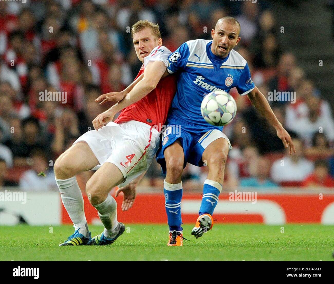 Football - Arsenal v Olympiakos - UEFA Champions League Group Stage  Matchday Two Group F - Emirates Stadium, London, England - 11/12 - 28/9/11  Per Mertesacker (L) - Arsenal in action against