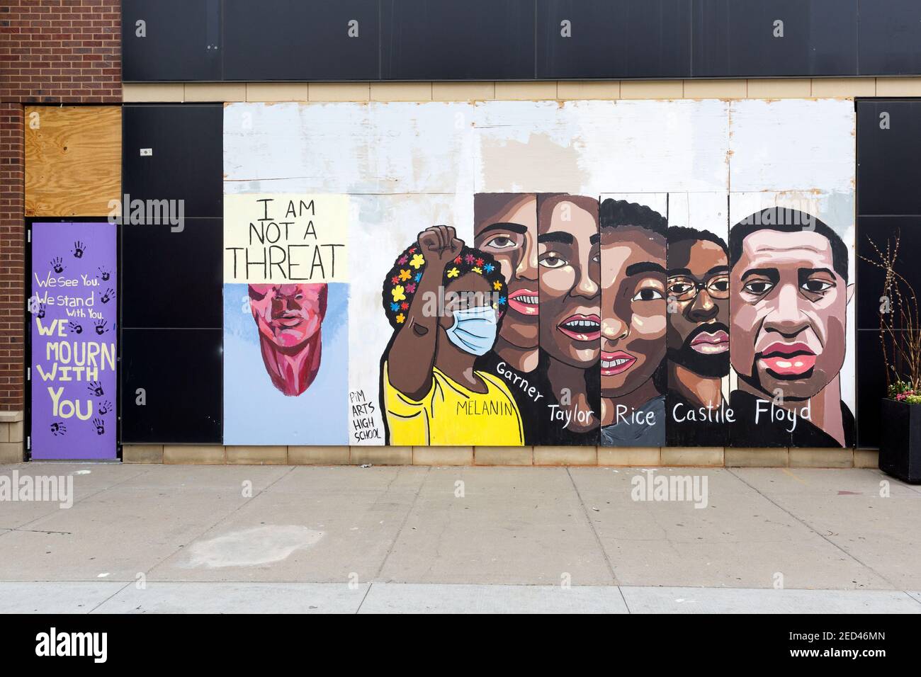 Painted murals on boards over a storefront windows during the civil unrest after the killing of George Floyd in Minneapolis, Minnesota.  The portraits Stock Photo