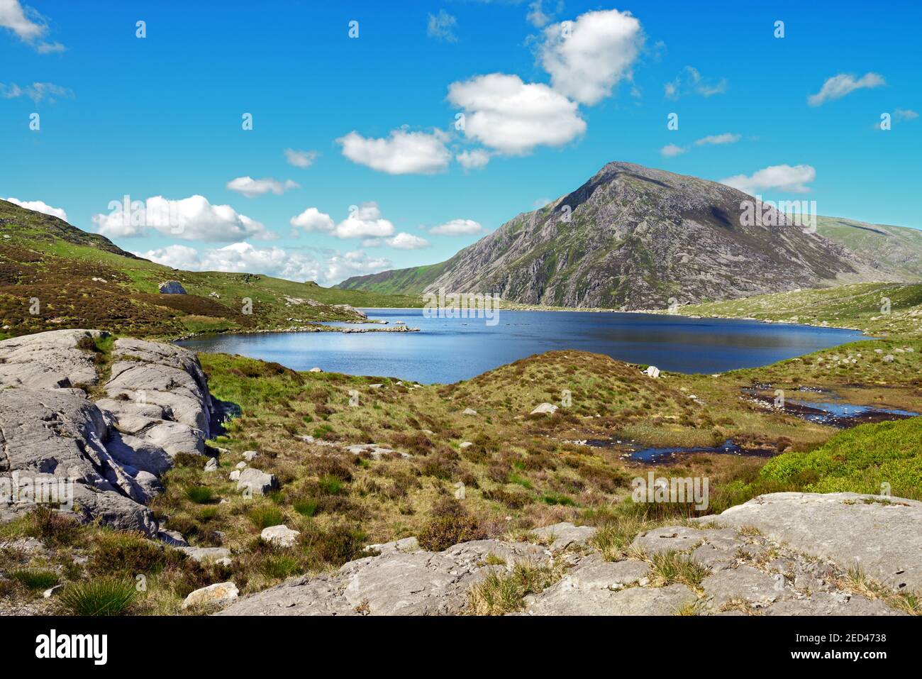 Llyn Idwal is a small mountain lake in the Glyderau mountain range in the Snowdonia National Park, Wales. Pen yr Ole Wen is in the background. Stock Photo