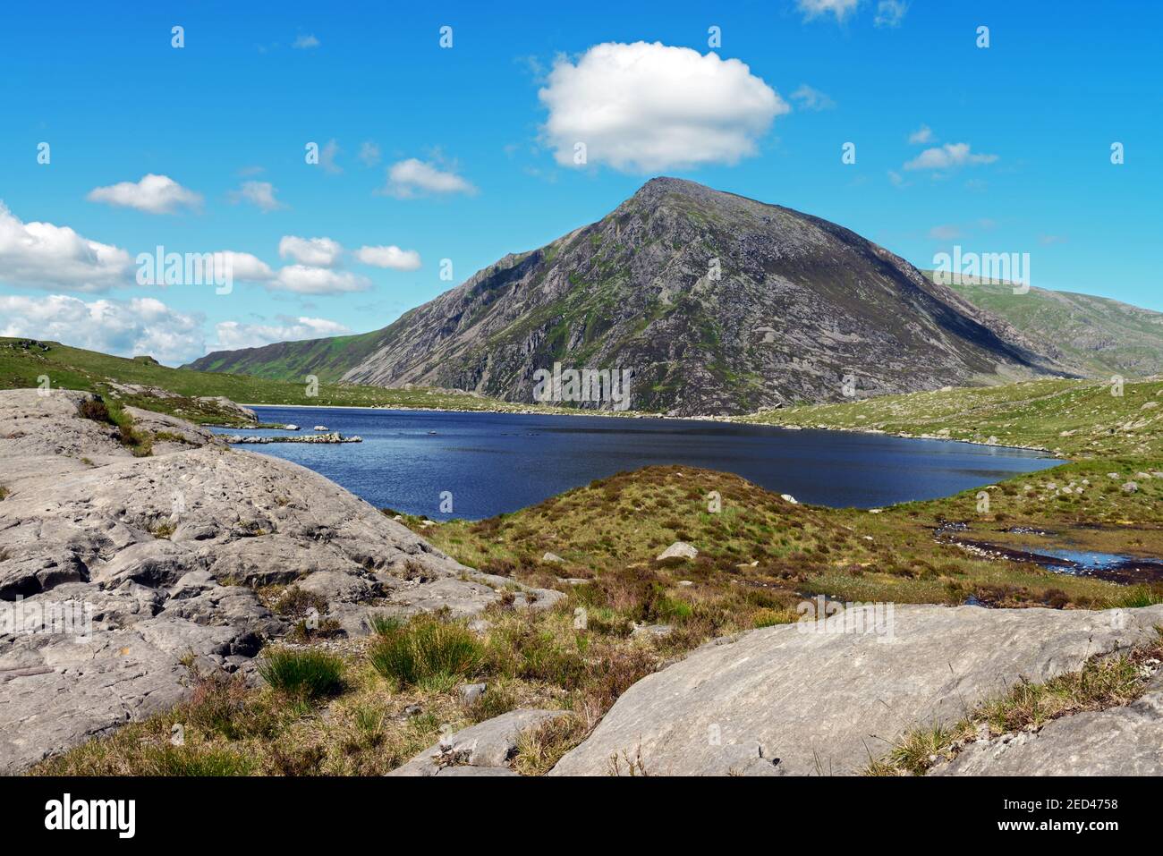Llyn Idwal is a small mountain lake in the Glyderau mountain range in the Snowdonia National Park, Wales. Pen yr Ole Wen is in the background. Stock Photo