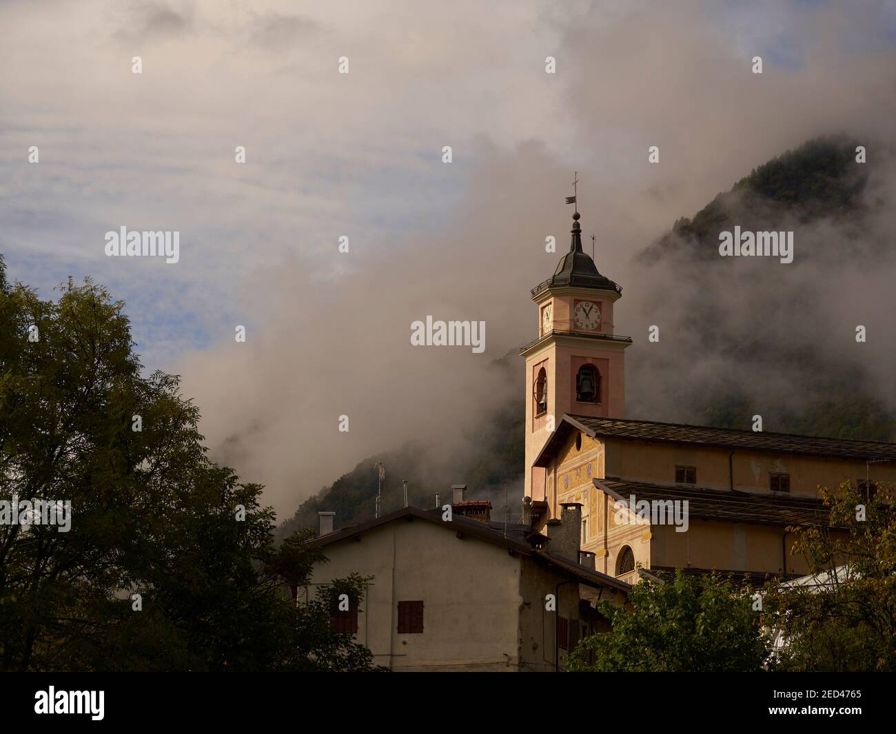 Village church, Entracuqe, Cuneo, Italy with the Maritime Alps in the background Stock Photo