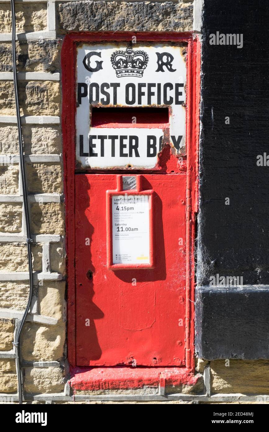 Old GR letter box in the wall of a house, Luddenden, West Yorkshire ...