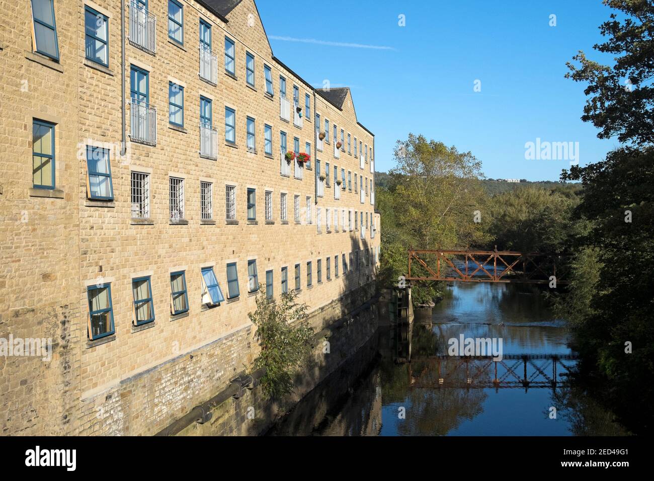 Mill alongside the River Calder, now converted to apartments, Sowerby Bridge, West Yorkshire Stock Photo
