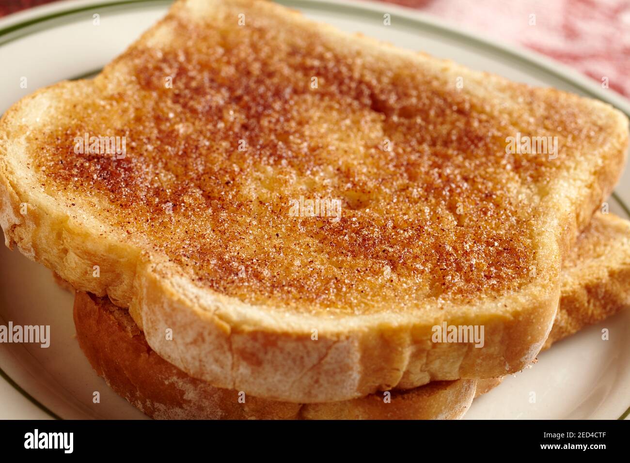 Two slices of cinnamon toast on a plate Stock Photo