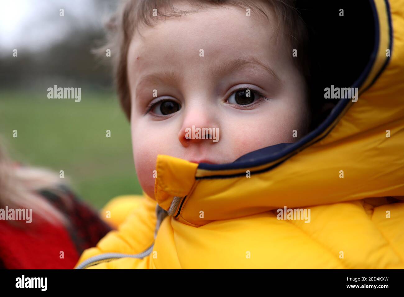 A one year old baby boy pictured looking smart and hanging out with his Mum in Chichester, West Sussex, UK. Stock Photo
