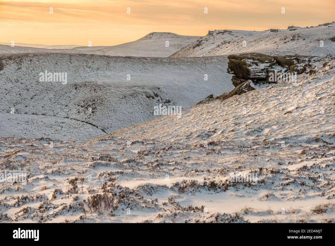 Late afternoon light on The southern edge of Kinder Scout in winter snow, Peak District National Park, UK, Stock Photo