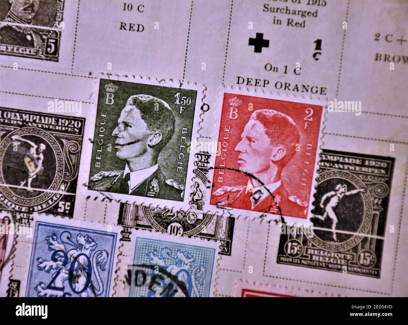 Collectors old world wide postage postal stamps in album, first half of the 20th twentieth century with some dates and cancelations by stmp collectors Stock Photo