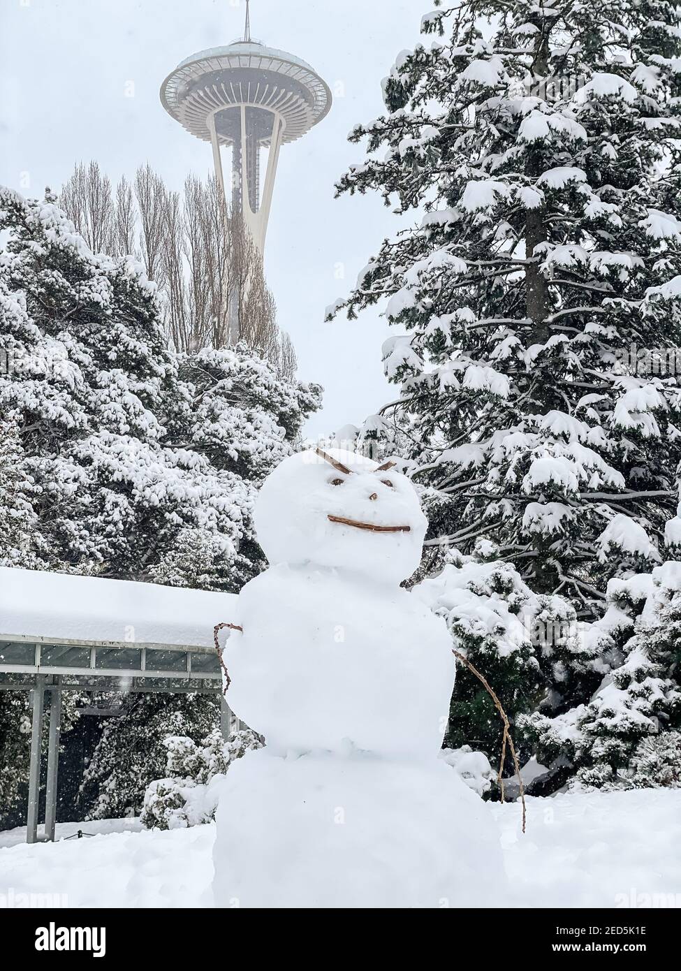 Seattle, USA. 13th Feb, 2021. Mid-day an angry Snowman at the Seattle Center in the snow. Stock Photo