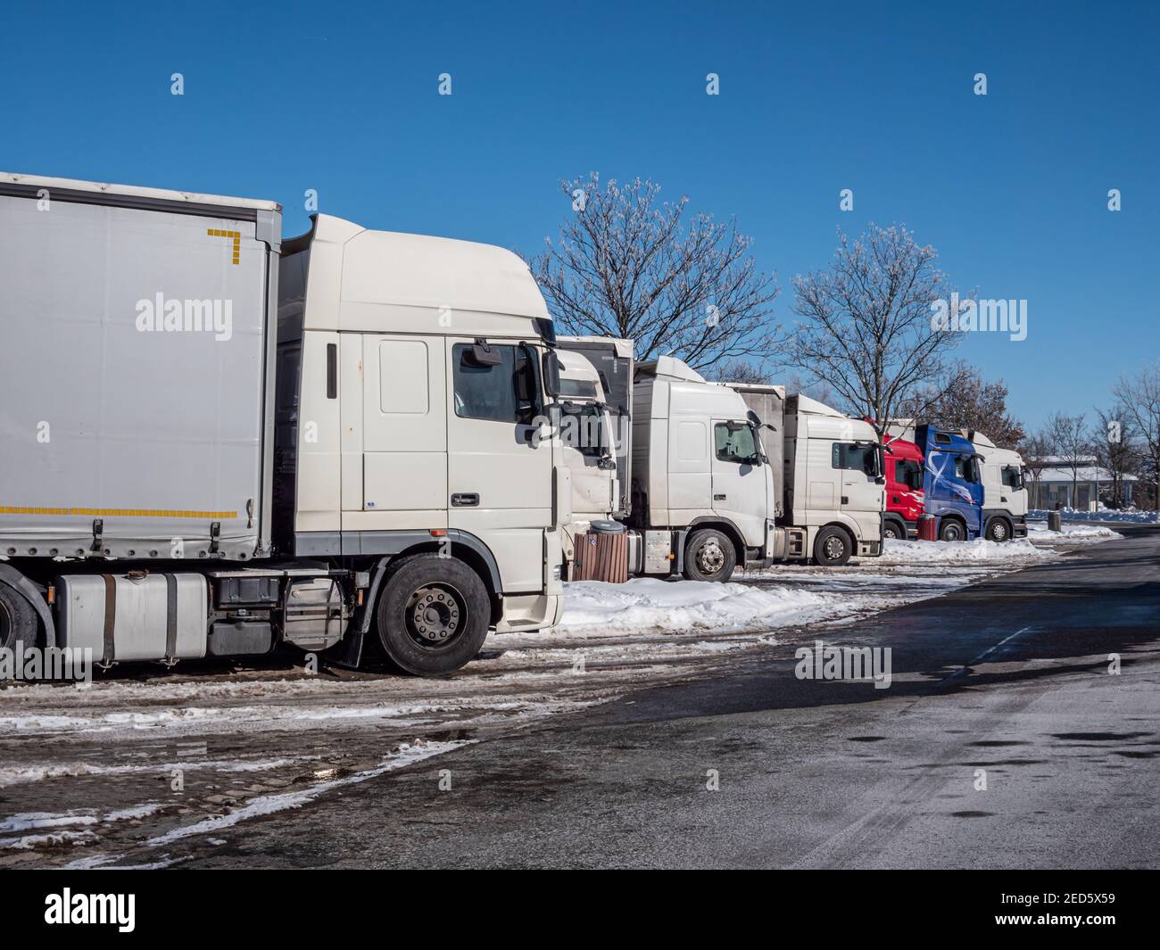 Trucks at a rest area in winter on a German highway Stock Photo