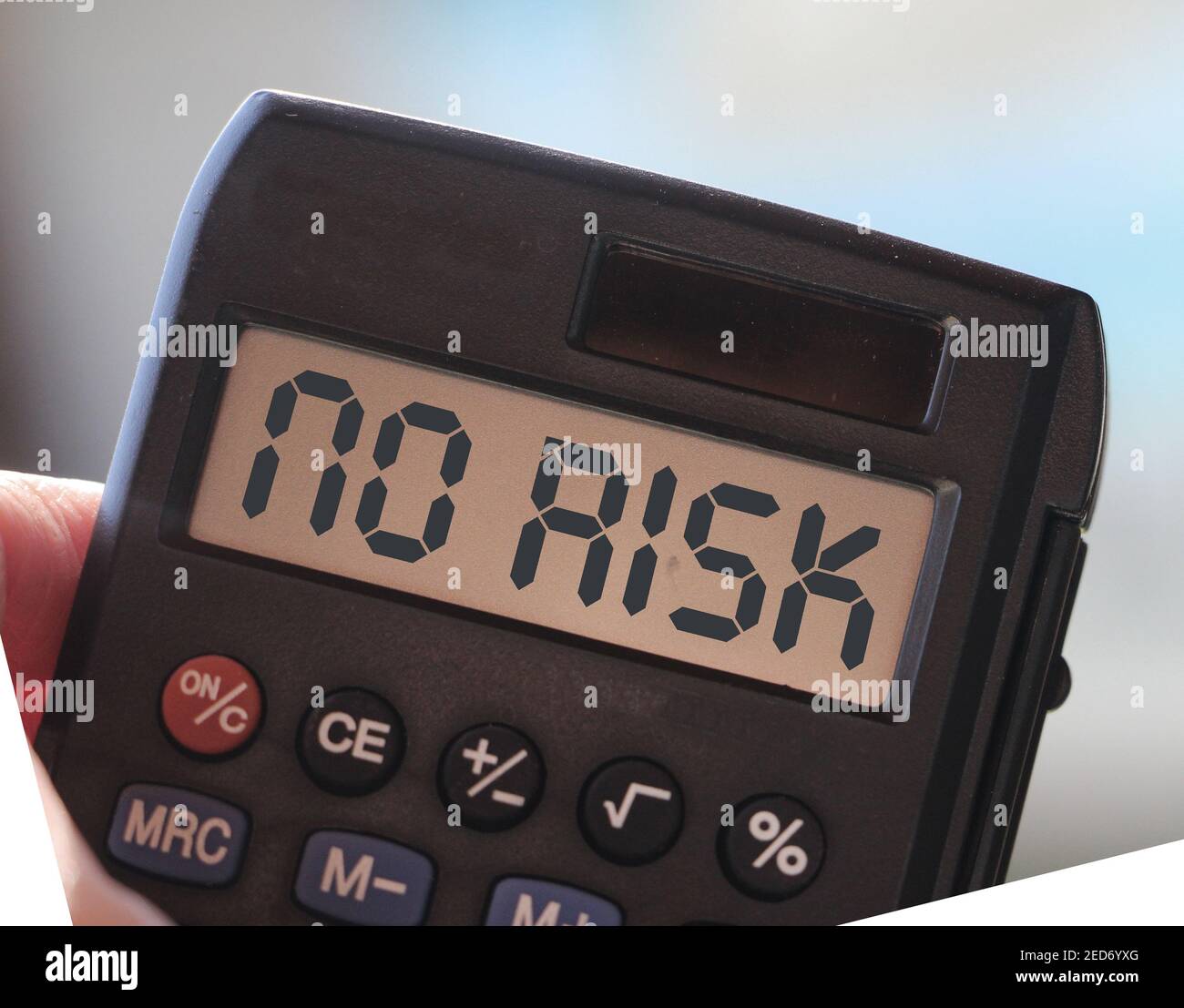No Risk Chart Word No risk on display of calculator on blurred ocean background ...