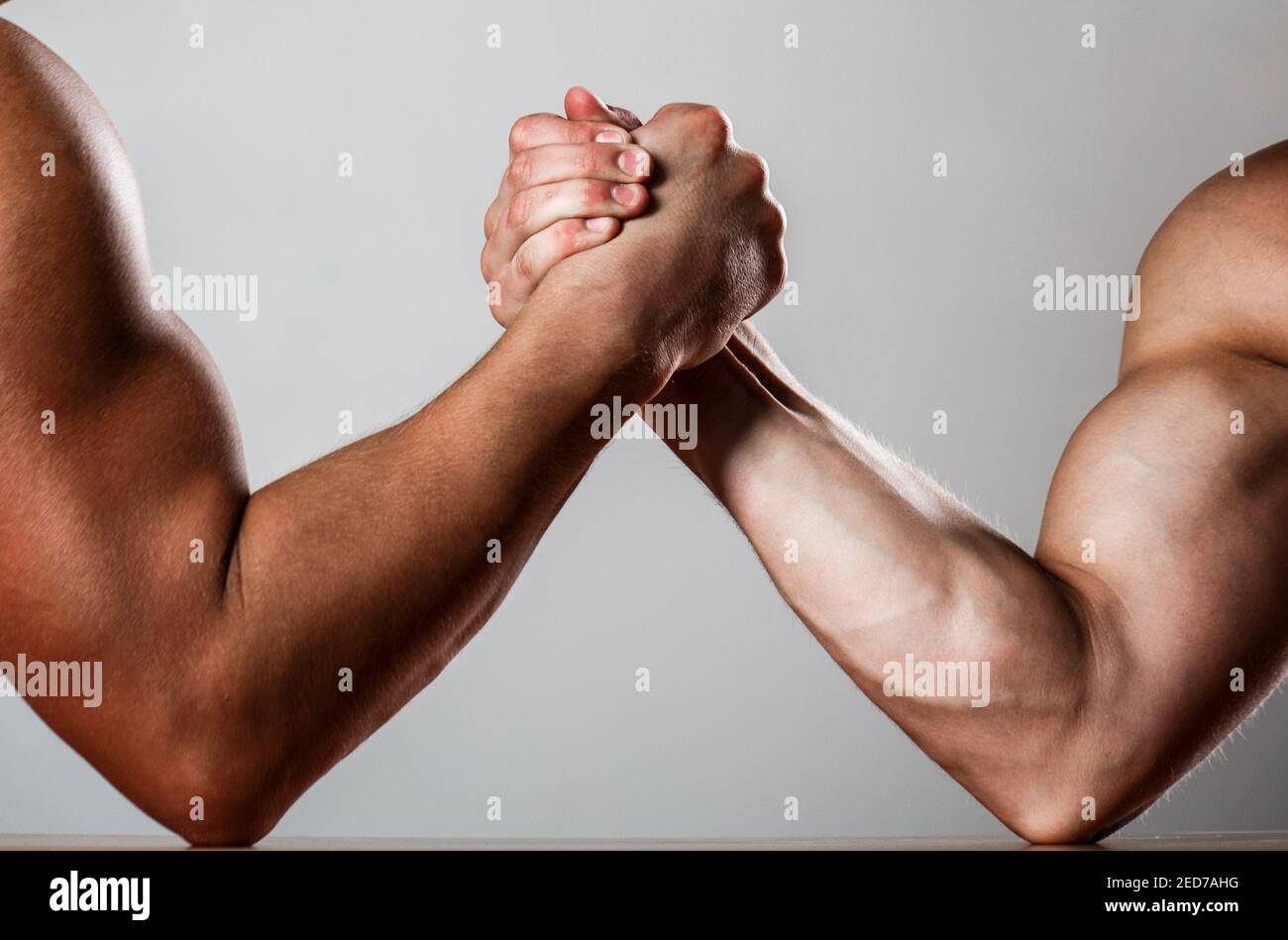 Hand wrestling, compete. Hands or arms of man. Muscular hand. Clasped
