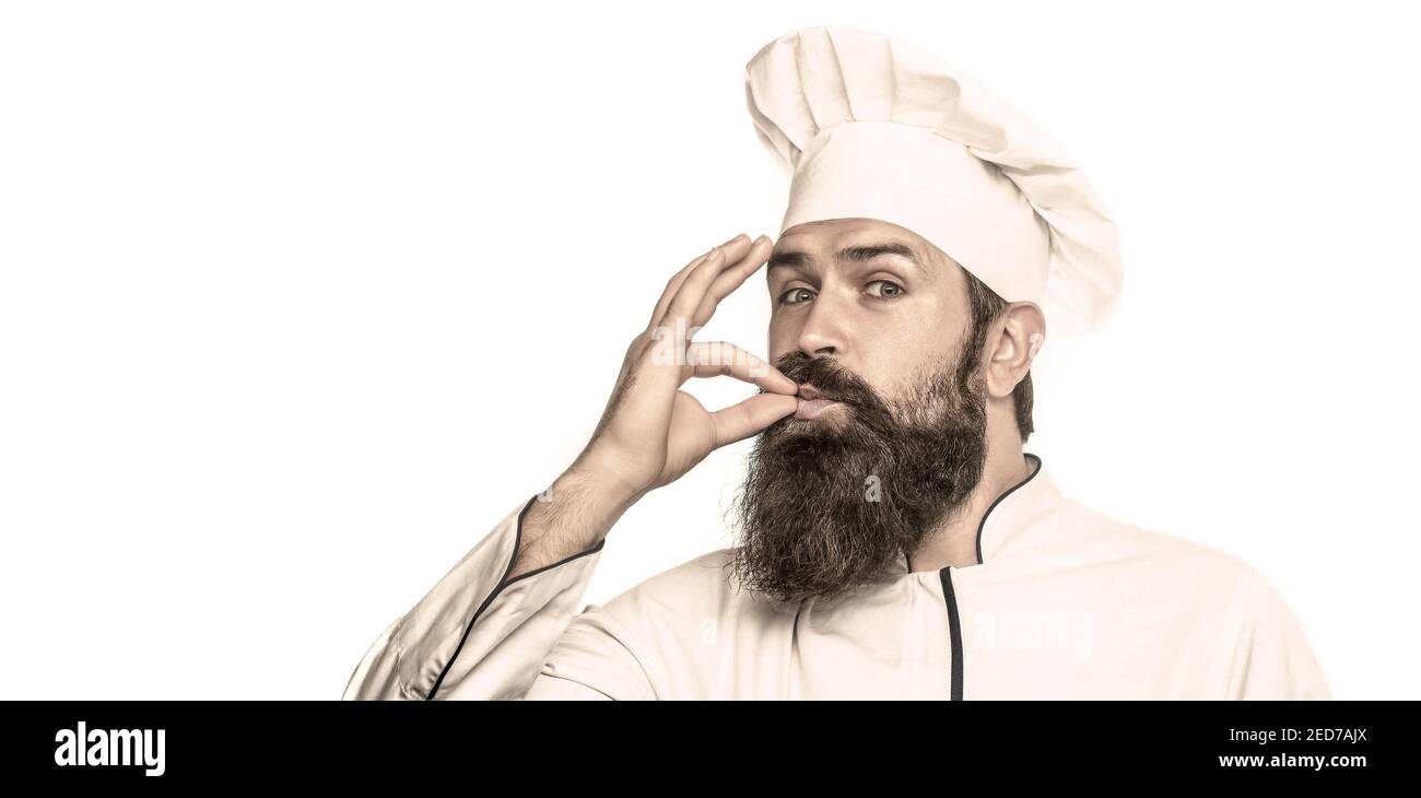 Chef, cook making tasty delicious gesture by kissing fingers. Cook hat. Bearded chef, cooks or baker. Bearded male chefs, perfect. Professional chef Stock Photo