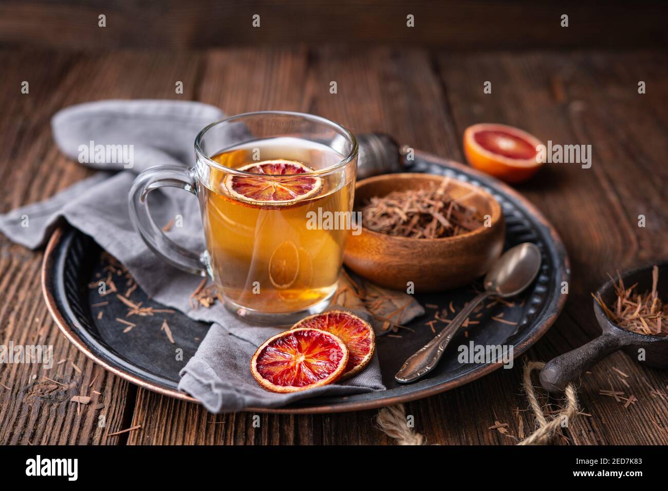 Medicinal Pau d'Arco bark tea also known as Lapacho in a glass cup on wooden background Stock Photo