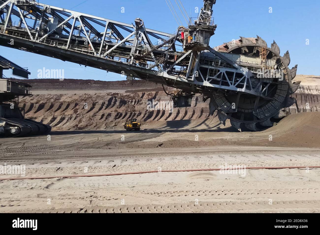 The work of a bucket wheel excavator in a quarry. Ore mining in a